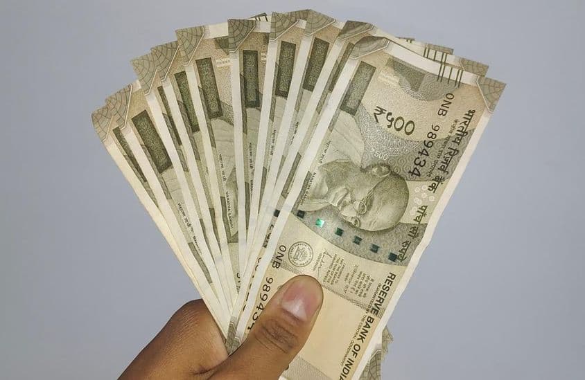 500 Indian rupee banknotes held in hand.