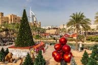 View of Burj Al Arab hotel from Madinat Jumeirah with a Christmas tree in Dubai.