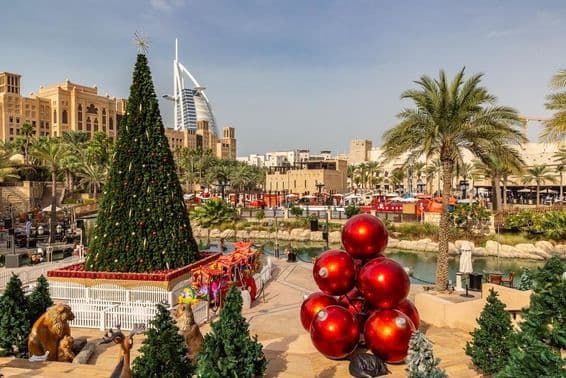 View of Burj Al Arab hotel from Madinat Jumeirah with a Christmas tree in Dubai.