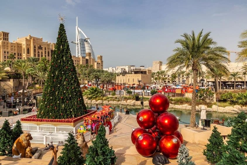 View of Burj Al Arab hotel from Madinat Jumeirah with a Christmas tree in Dubai.