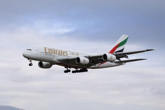 Emirates Airbus 380-800 airplane approaching the runway for landing.