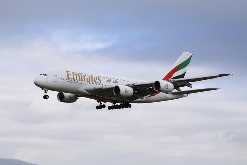 Emirates Airbus 380-800 airplane approaching the runway for landing.