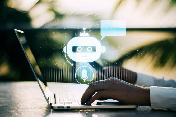 A person typing on a laptop with a blurred outdoor background featuring a chatbot icon.