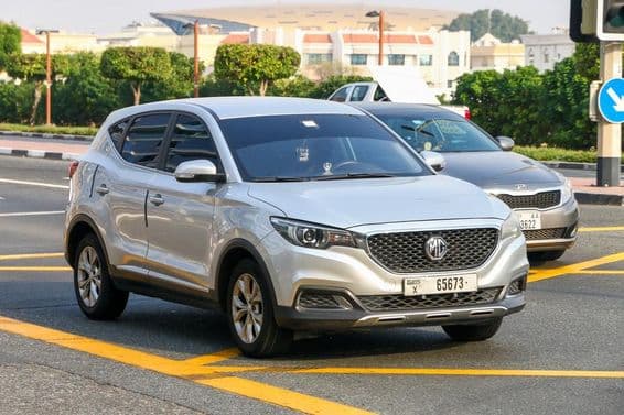 Small crossover SUV MG on an urban street.