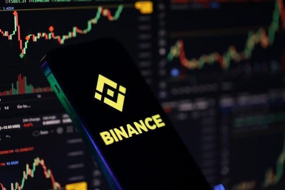 Binance logo on an iPhone screen.