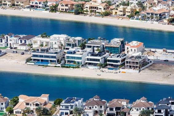 Dubai's The Palm Jumeirah artificial island with beachfront and luxury villas.