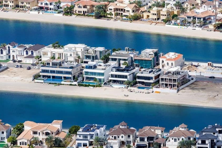 Dubai's The Palm Jumeirah artificial island with beachfront and luxury villas.