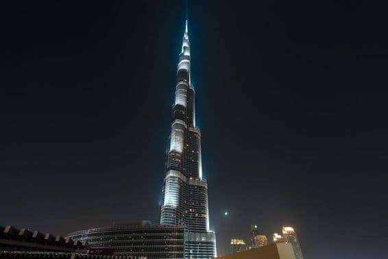 Burj Khalifa, shining against the night sky.