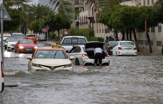 Floodwaters inundate a street in Dubai during heavy rainfall.