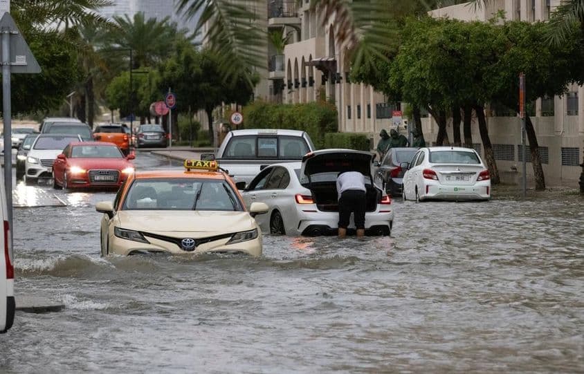 Floodwaters inundate a street in Dubai during heavy rainfall.