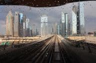 Rainy cityscape of Dubai while sitting on the metro.