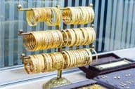 Gold bracelets available at a jewelry store.