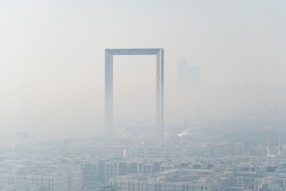 Stunning panorama in fog of the world's largest gold frame made in Dubai.