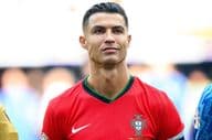 Cristiano Ronaldo in red soccer jersey.