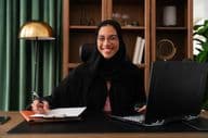 Dubai businesswoman wearing abaya in an office.