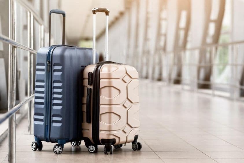 Luggage suitcases waiting in the terminal hall.