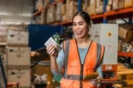 Warehouse staff employee happy with a salary increase.