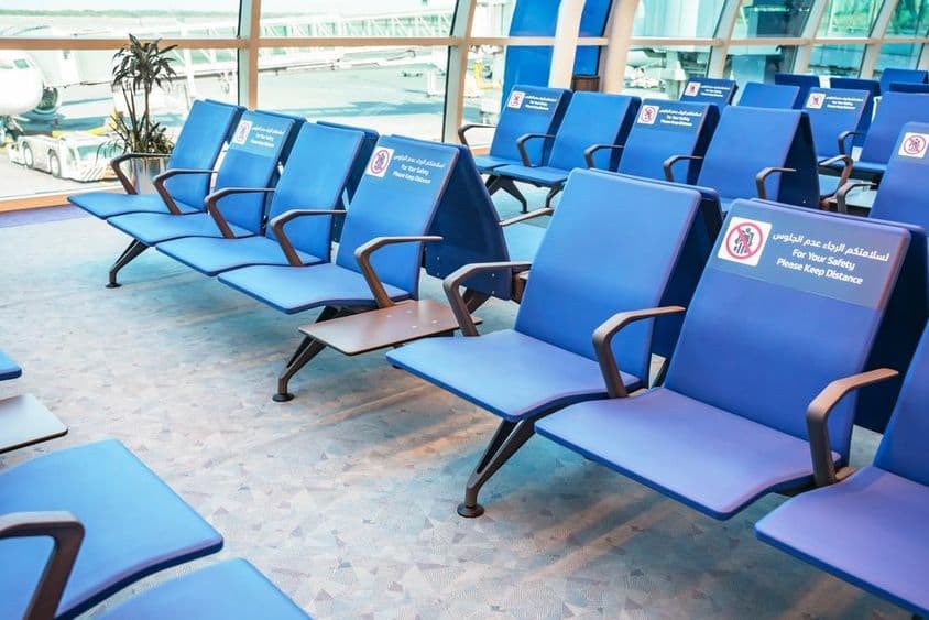 Rows of seats in an airport waiting area.