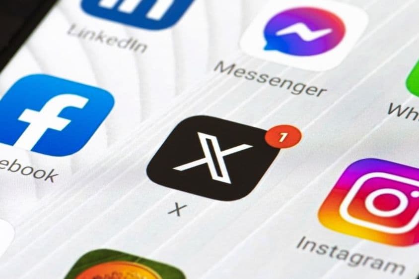 Twitter or X logo with initial letter and app on smartphone.