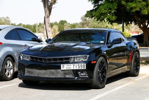 A Chevrolet Camaro on the city street.