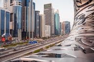 Cityscape of Dubai showcasing the Museum of the Future and Sheikh Zayed Avenue.