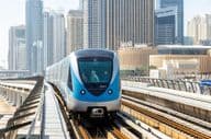 Dubai Metro train public transportation near Dubai Marina station.