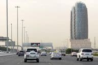 A busy Al Salam Street in Abu Dhabi with vehicles.