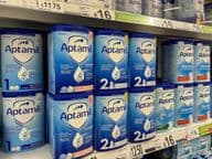 Aptamil milk powder on supermarket shelves.