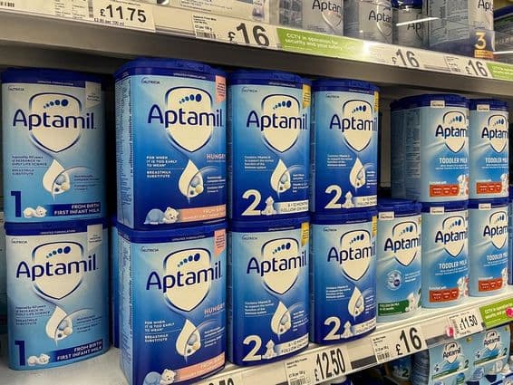 Aptamil milk powder on supermarket shelves.