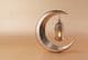 Decorative crescent with a glowing Ramadan lamp.