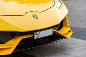 Close-up of Lamborghini logo on the car's front.