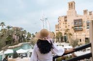 Scenic view of Burj Al Arab with female tourists.