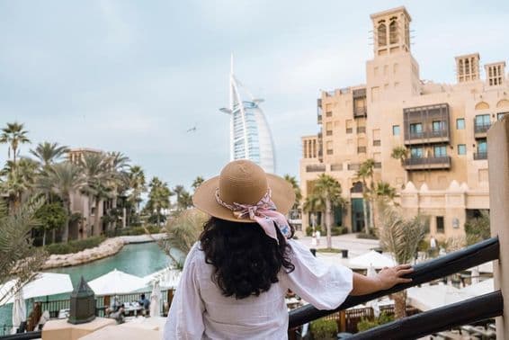 Scenic view of Burj Al Arab with female tourists.