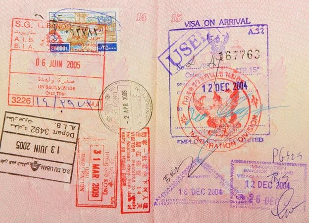 Passport with stamps from Thailand, Hong Kong, and Lebanon.
