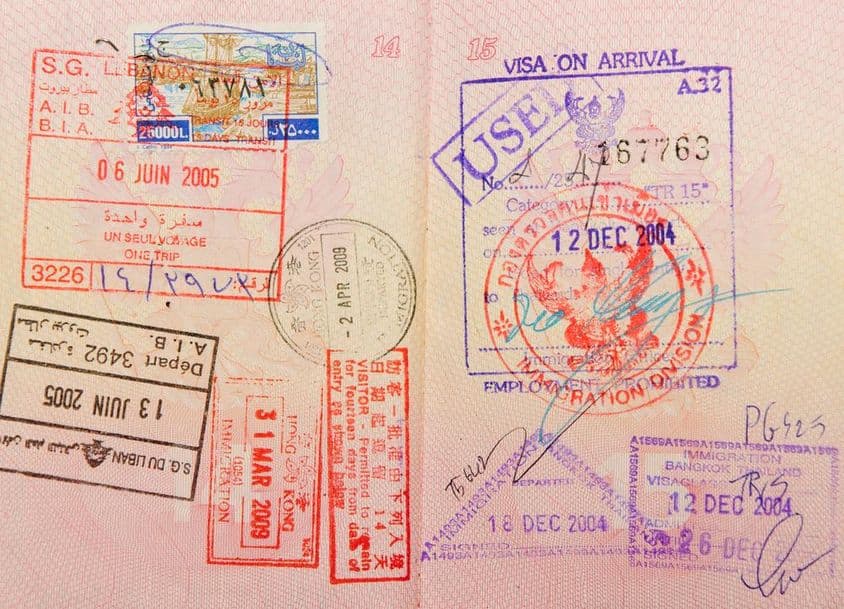 Passport with stamps from Thailand, Hong Kong, and Lebanon.