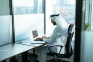 A man working in a Dubai business office.