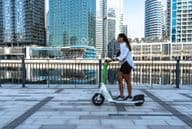 An electric scooter on the Dubai Marina promenade.