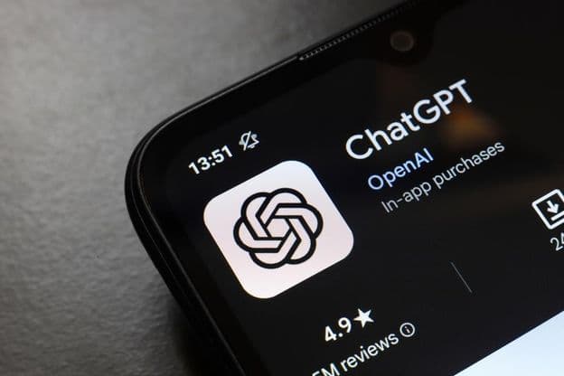 The ChatGPT app logo displayed on a smartphone screen.
