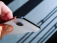 A hand holding the new Apple iPhone Air smartphone.