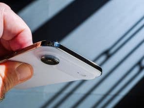 A hand holding the new Apple iPhone Air smartphone.