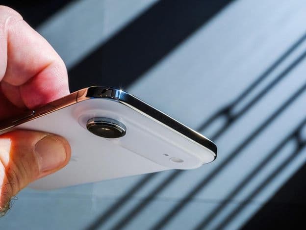 A hand holding the new Apple iPhone Air smartphone.