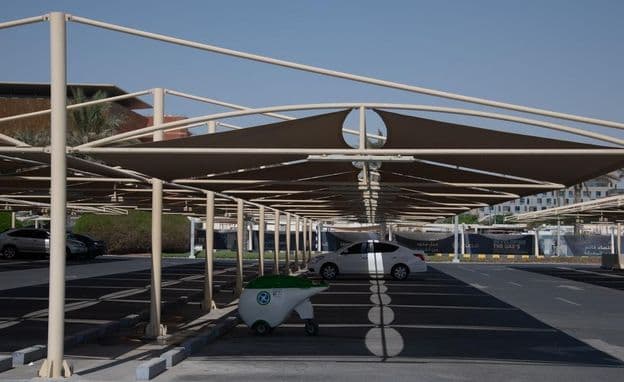 Fabric covers over parking spaces in Dubai.