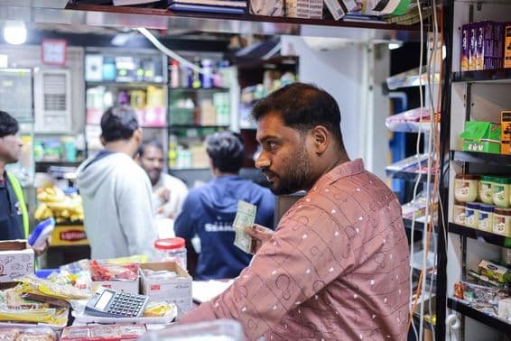 People shopping at a local market in Dubai.