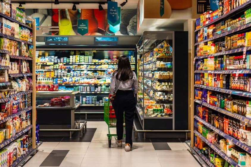 A young woman shopping at Lulu supermarket.