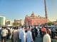 Large crowd gathered in front of the grand mosque.