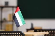 The flag of the United Arab Emirates on a desk in the classroom