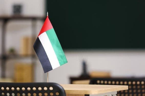 The flag of the United Arab Emirates on a desk in the classroom