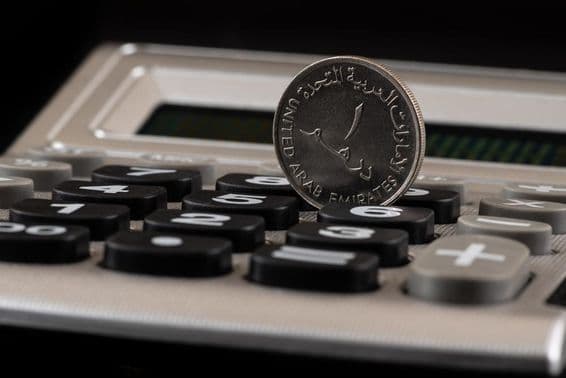 United Arab Emirates 1 dirham coin and calculator