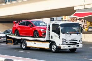 Isuzu Reward NPR white tractor unit.