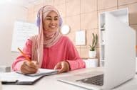 Young Muslim woman studying